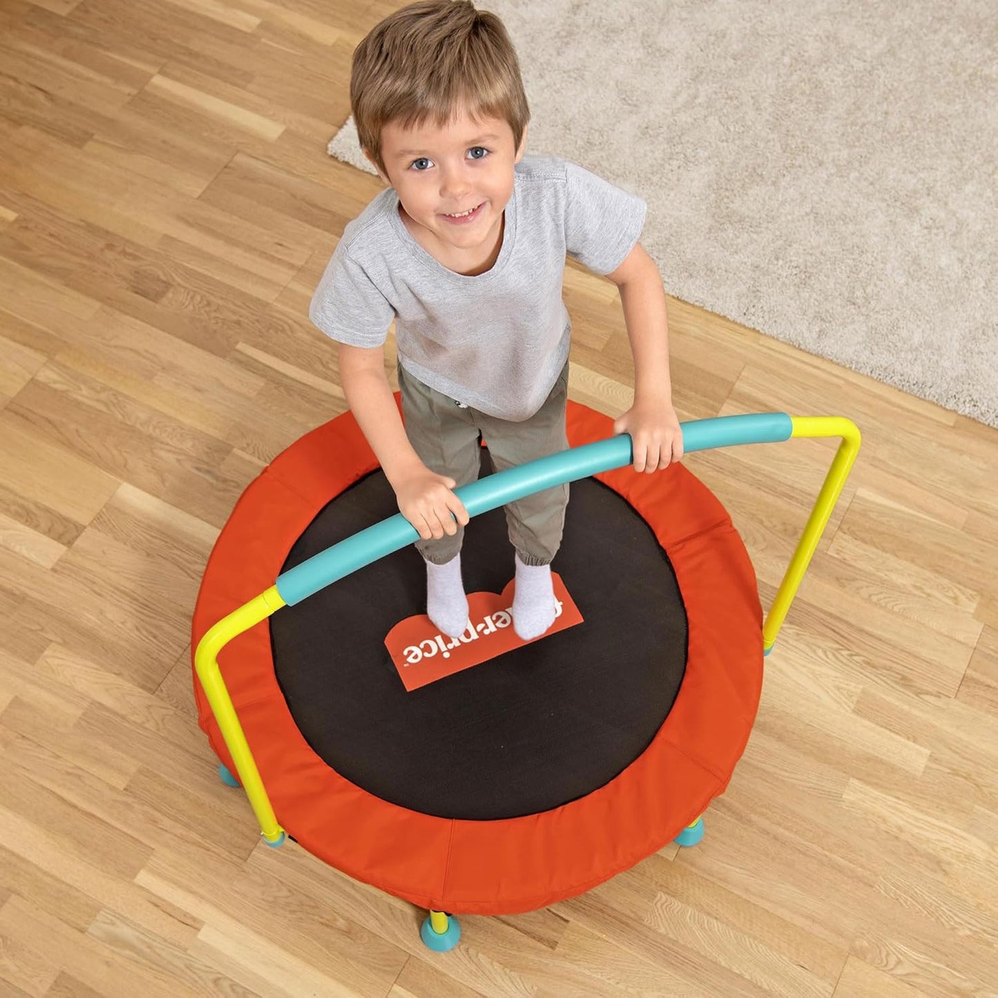 Fisher-Price 36-Inch Mini Trampoline, WonderJump Round Indoor Kids Trampoline with Stabilizing Handlebar, Multicolor