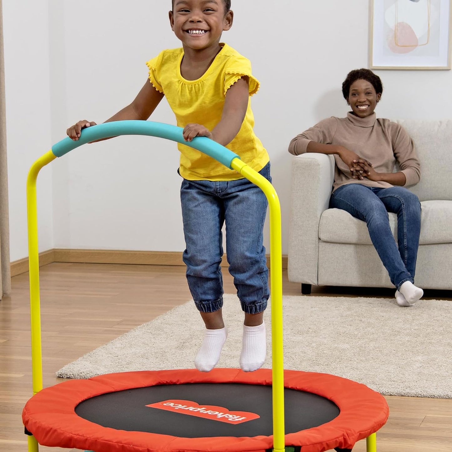 Fisher-Price 36-Inch Mini Trampoline, WonderJump Round Indoor Kids Trampoline with Stabilizing Handlebar, Multicolor